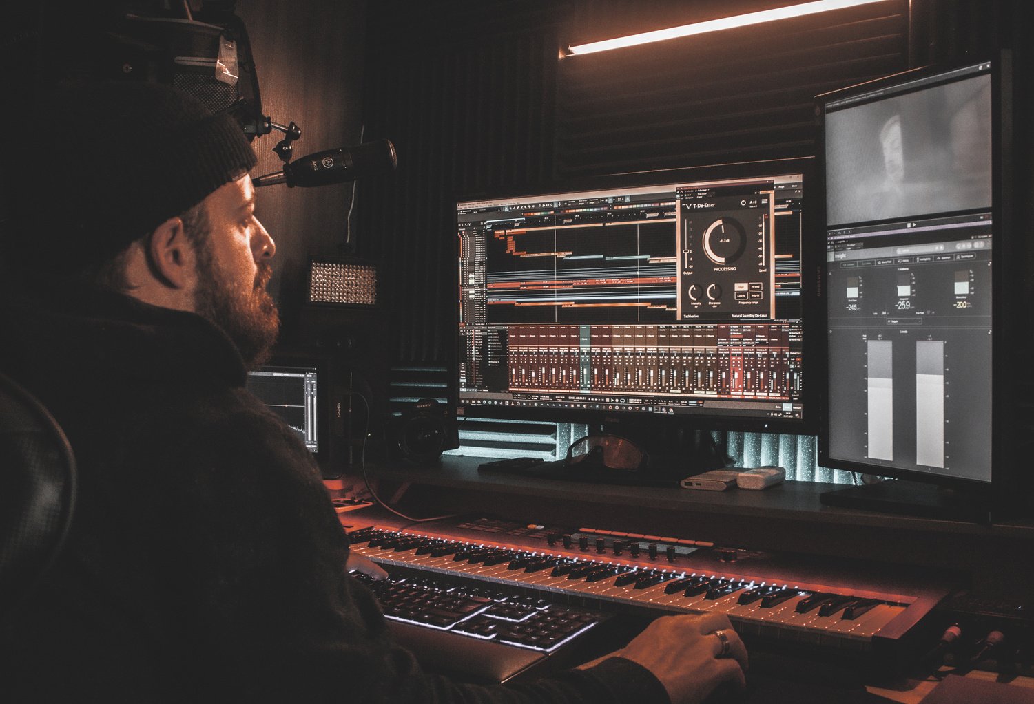 Man in Black Jacket Playing Audio Mixer