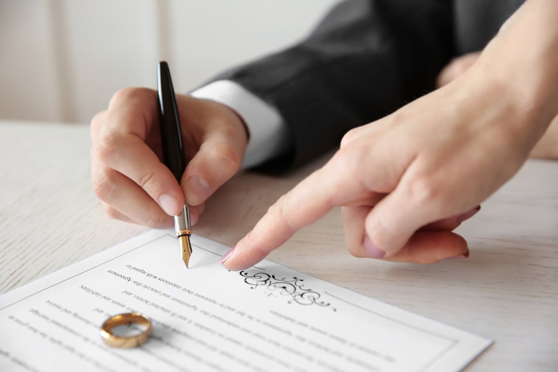 Man Signing a Marriage Contract